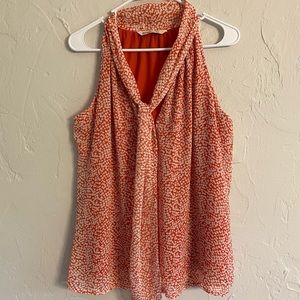 Orange and white sleeveless top